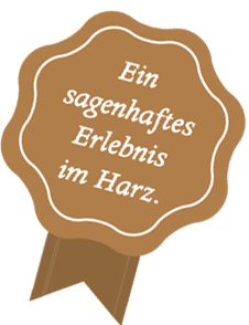 Ein Siegel mit der Aufschrift "Ein sagenhaftes Erlebnis im Harz" - ein Symbol für die unvergesslichen Erfahrungen und Abenteuer, die man in dieser malerischen Region erwarten kann.